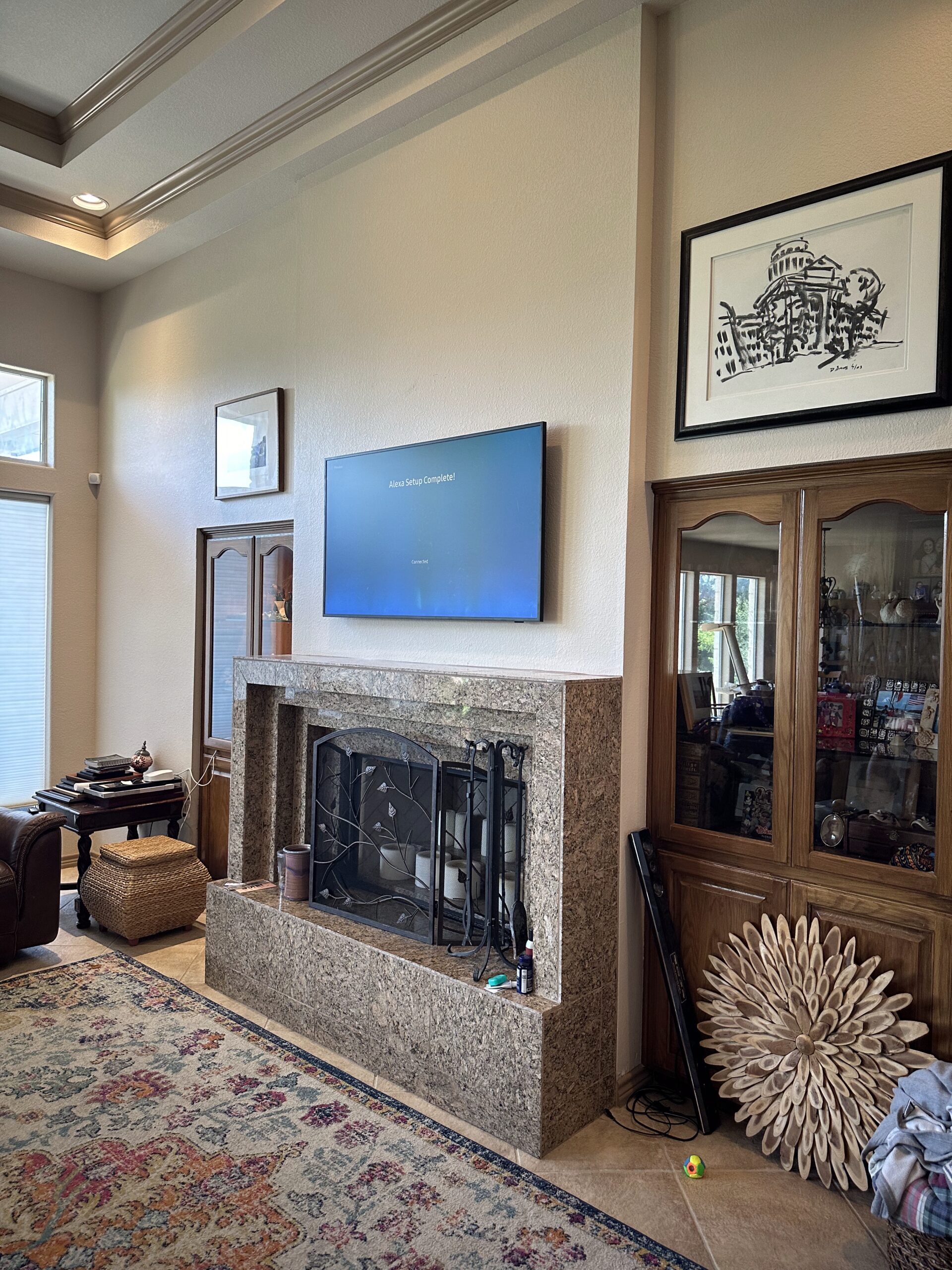 65 inch Samsung Frame TV over fireplace with wires routed to cabinet in Westlake Hills Austin